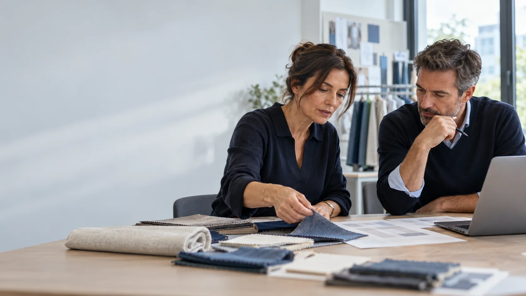 Two professionals reviewing materials and operational documents. Illustrative AI-generated scene.